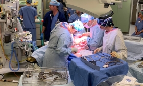 People performing surgery